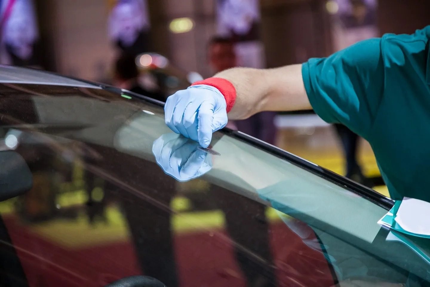 Auto glass technician preparing materials