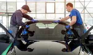 Car windshield repair in progress