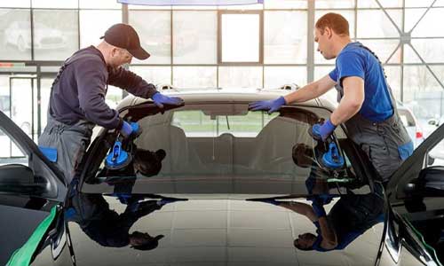 Car windshield repair in progress