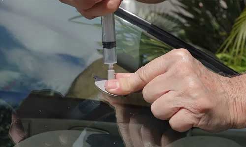 Close-up of cracked auto glass repair